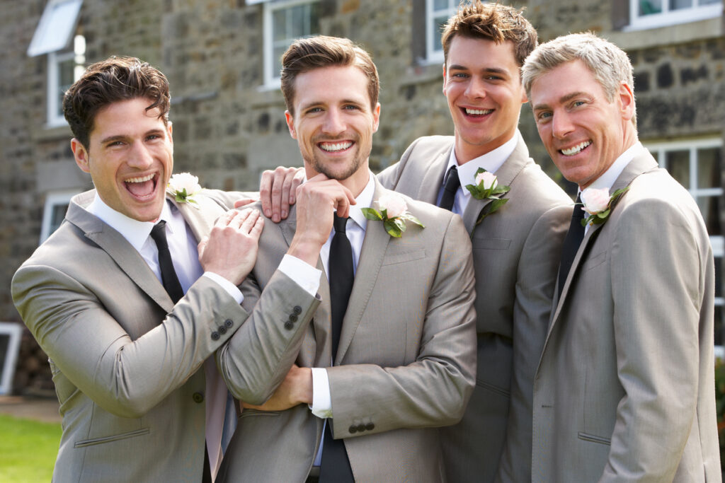 Groom With Best Man And Groomsmen At Wedding - Tuxedo Rental